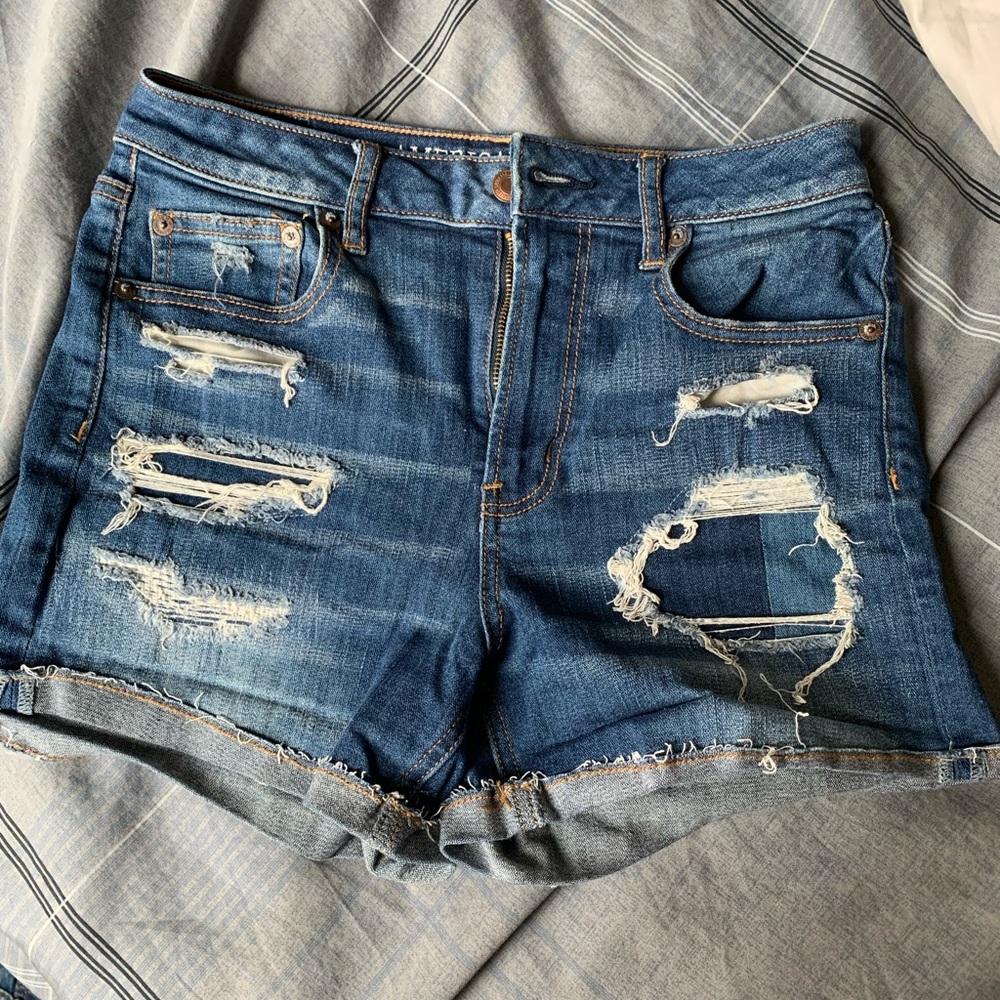 High-rise distressed denim shorts